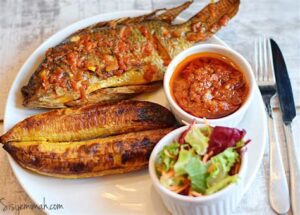 Roasted Tilapia and Plantain (Boli) with Pepper sauce - Image 2